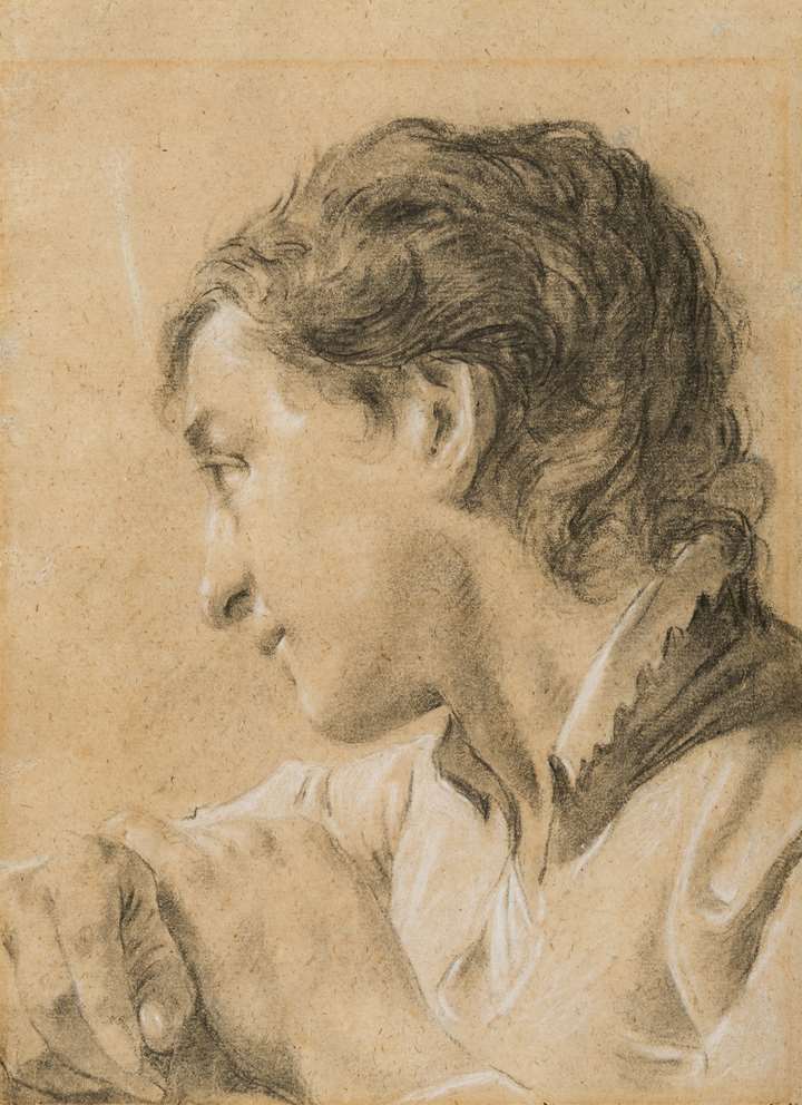 A Young Man Looking Down to the Left